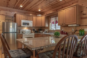 A full sized kitchen in the home allows for everything you'll need to cook meals for you and your family during your stay.