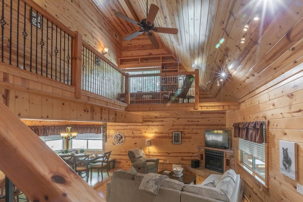 Beautiful craftsmanship creates a striking interior for this beautiful cabin nestled in the trees among Dahlonega's surrounding hillsides