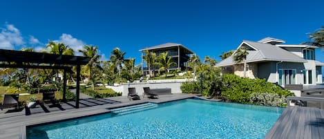 Welcome to Windchat, beachfront estate with heated ocean-view infinity pool, tennis court, pickleball, basketball, shuffleboard, kayaks, foosball, ping-pong and more.