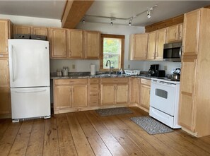 Kitchen has loads of storage and is stocked with all items needed for your stay