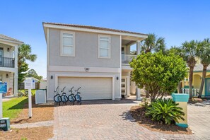 Front/Garage/Entry  | Breathe Easy Rentals - Front side of this lovely home with side entrance on the right. Bikes provided by La dolceVita. Be sure to contact them for information.