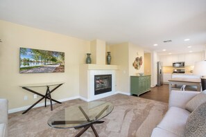 Open floor plan family room soaked in sunlight! Read, binge Netflix or gather!