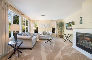 Open floor plan family room soaked in sunlight! Read, binge Netflix or gather!