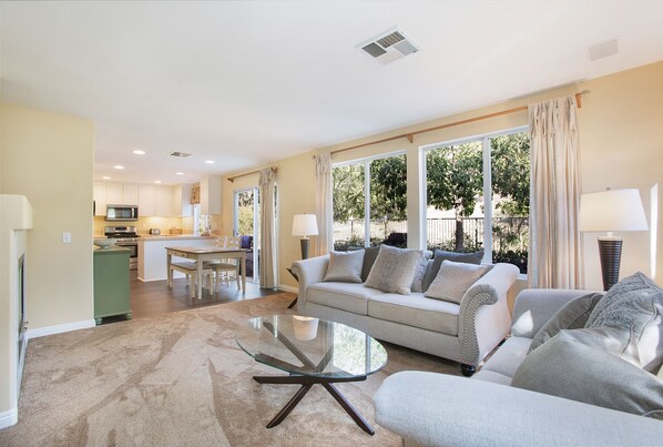 Open floor plan family room soaked in sunlight! Read, binge Netflix or gather!