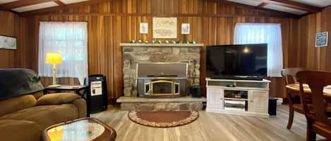 Open floor plan living room/dining room with fireplace