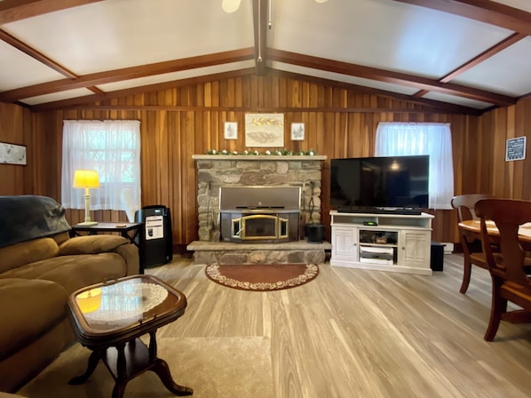 Open floor plan living room/dining room with fireplace