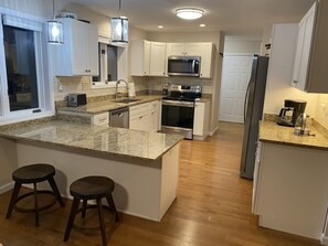 View of kitchen from living/dining room area.