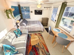 Open, single room living is sun-drenched with everything you need, nothing more