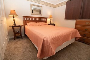 Queen-sized bed in bedroom; with Flat screen TV