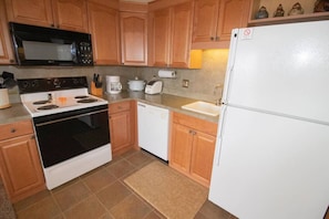 Remodeled kitchen is fully-equipped with pots, pans & utensils