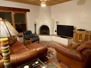 TV room with fireplace, leather furniture, & 50” TV with Roku & DirectTV Choice