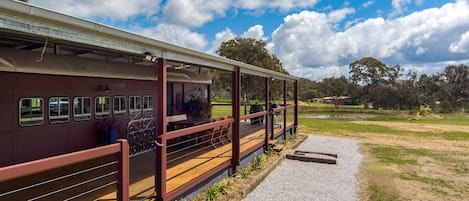 1928 Red Rattler carriage, with a huge verandah.