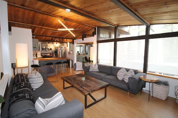 LIving area, kitchen in background