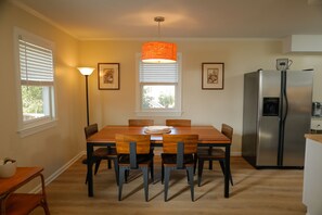 Open floor plan with gorgeous dining room table and 6 solid chairs.