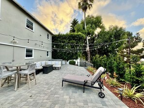 4 person hot tub, gas fire pit, outdoor seating, and outdoor dining table 