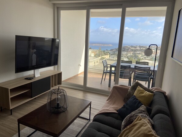 Living area with smart TV, Front 
terrace with views