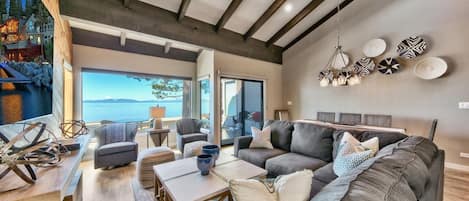 The great room is clean and comfortable a sectional sofa and 2 club chairs.