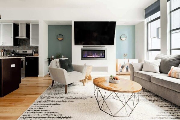Cozy up by the fireplace in the living room