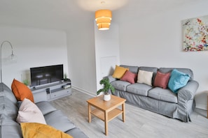 Modern Stylish Living Room with Large Flat Screen TV, Netflix & Free Wifi with seating for up to 12 people. which also has a Comfy Sofa bed and USB S0ckets