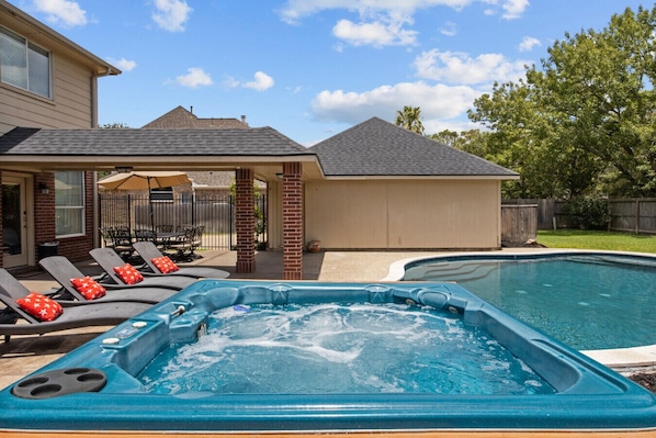 Relax & Unwind – Soak in the bubbling hot tub or take a dip in the refreshing pool. Lounge under the covered patio or enjoy outdoor dining in this private backyard retreat!