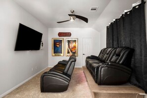 Theatre room with Xbox Series S and 6 theatre seats. The closet also contains boards games like playing cards, Uno, Battleship, Poker, dominoes, Trouble, Guess Who, Mancala, Mastermind, puzzles and more