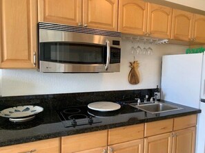 Kitchen with convection oven/microwave Glass top two burner stove top