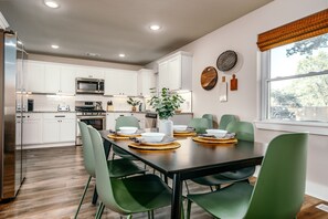 Open concept kitchen with seating for 8.
High chair available.