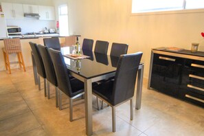 Indoor Dining for Eight – Large dining table in a light-filled space, perfect for shared meals and holiday conversations.