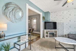 Cozy living room with Smart TV and Sofa Bed that converts into a full size bed.