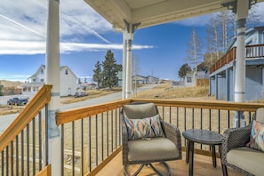 Enjoy a cup of coffee on the front covered porch