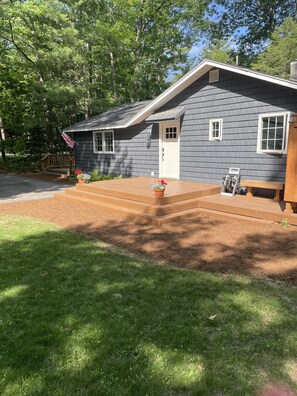  The spacious grassy yard is nestled in the trees for ultimate privacy
