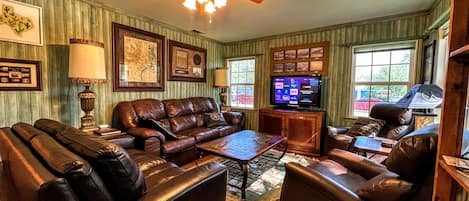 Livingroom area with plenty seating and Texas memorabilia abound  