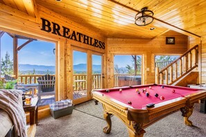 Lower-level game room with the hot tub right outside the door