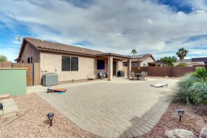 Set up cornhole and have a backyard BBQ