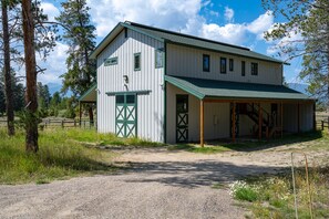 Private drive way leads you to two parking spaces with covered stairway up to the unit.