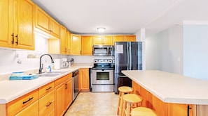 In Unit A, come on in and enter into the open, fully-equipped kitchen where you can cook in.