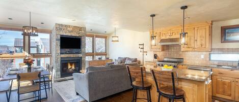 Telluride Lodge 326 offers an open, contemporary living room/kitchen area with a gas fireplace.