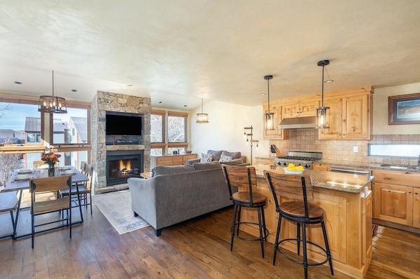 Telluride Lodge 326 offers an open, contemporary living room/kitchen area with a gas fireplace.