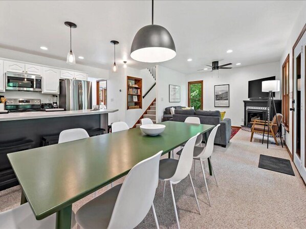 Share meals and moments around the dining table that opens to both the kitchen and living room.