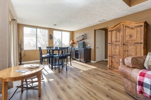 Game or bar area with drinks fridge and HDTV