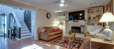 Family room with 2 sleeper sofas and a large tv complete with Roku!