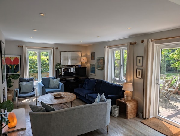 With four huge newly installed double glazed Danish windows, light floods into the sitting room all day and ensures a peaceful and warm setting for our guests.