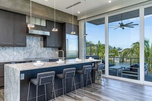 2nd level sleek and modern kitchen with top line appliances.