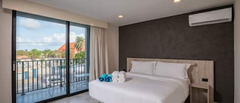 Master Bedroom with comfortable King size bed and private balcony