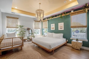 The master bedroom is full of natural light ands a King bed plus and a twin bed