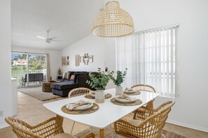 Bright dining area big enough for the whole family to enjoy *Flooring updated