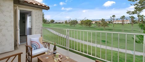 Enjoy a meal or some games on the large patio with golf course and mountain view