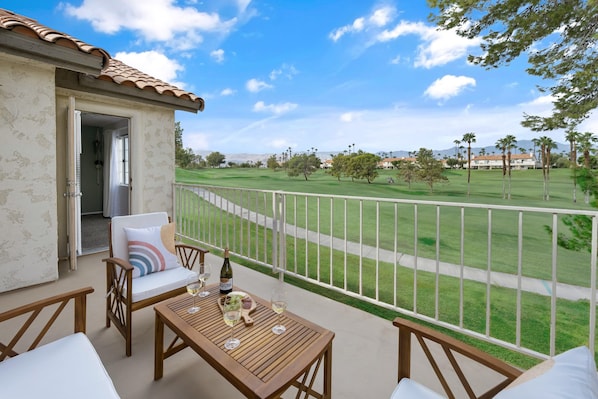 Enjoy a meal or some games on the large patio with golf course and mountain view