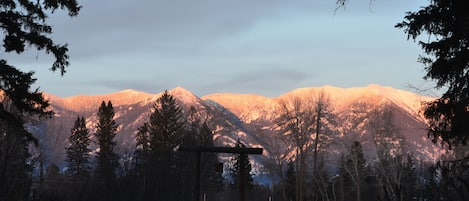 Alpen Glow on the Swan Mountains as seen from the front yard.