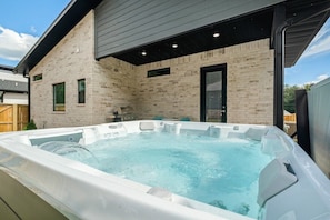 Unwind in our large hot tub spa with seating for 6!